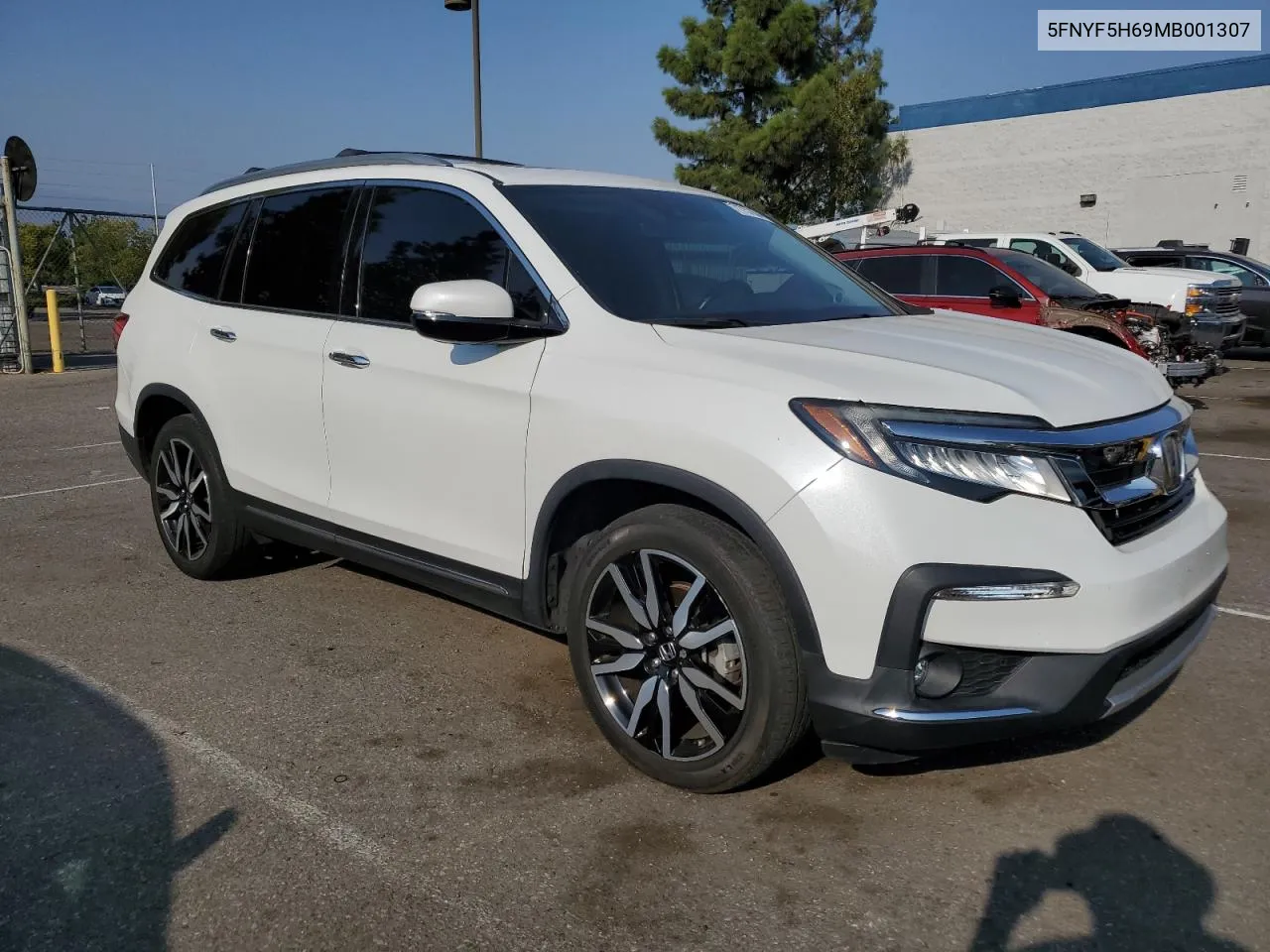 2021 Honda Pilot Touring VIN: 5FNYF5H69MB001307 Lot: 71757804