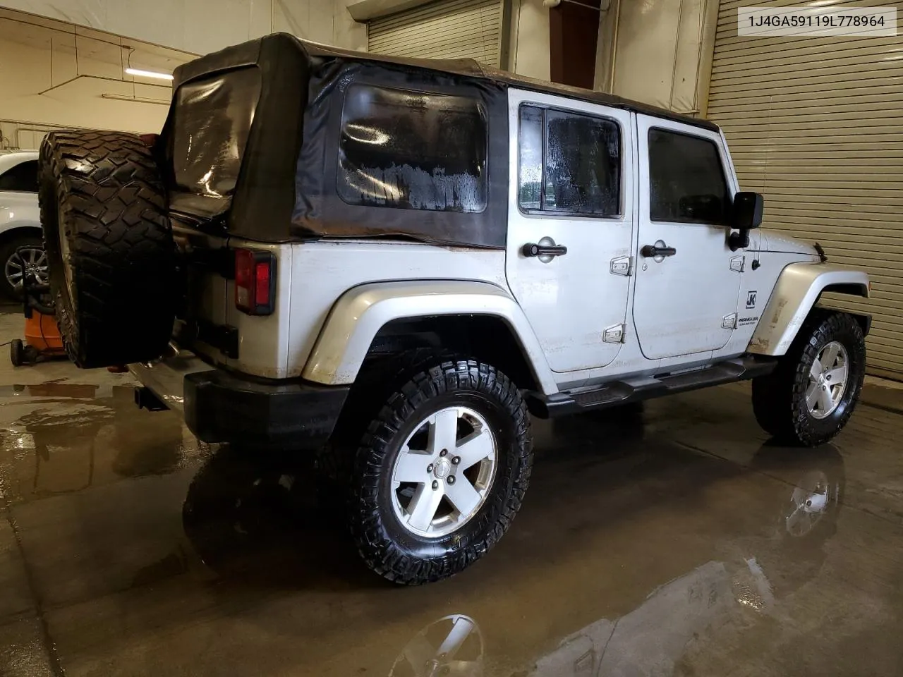 2009 Jeep Wrangler Unlimited Sahara VIN: 1J4GA59119L778964 Lot: 61563994