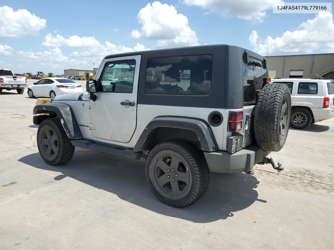 2009 Jeep Wrangler Sahara VIN: 1J4FA54179L779166 Lot: 62806754