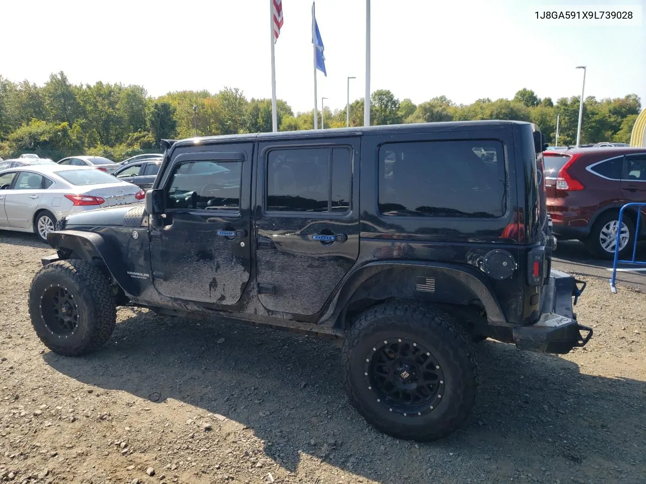 2009 Jeep Wrangler Unlimited Sahara VIN: 1J8GA591X9L739028 Lot: 71052274