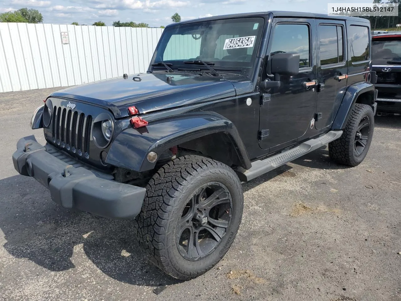 2011 Jeep Wrangler Unlimited Sahara VIN: 1J4HA5H15BL512147 Lot: 64854364