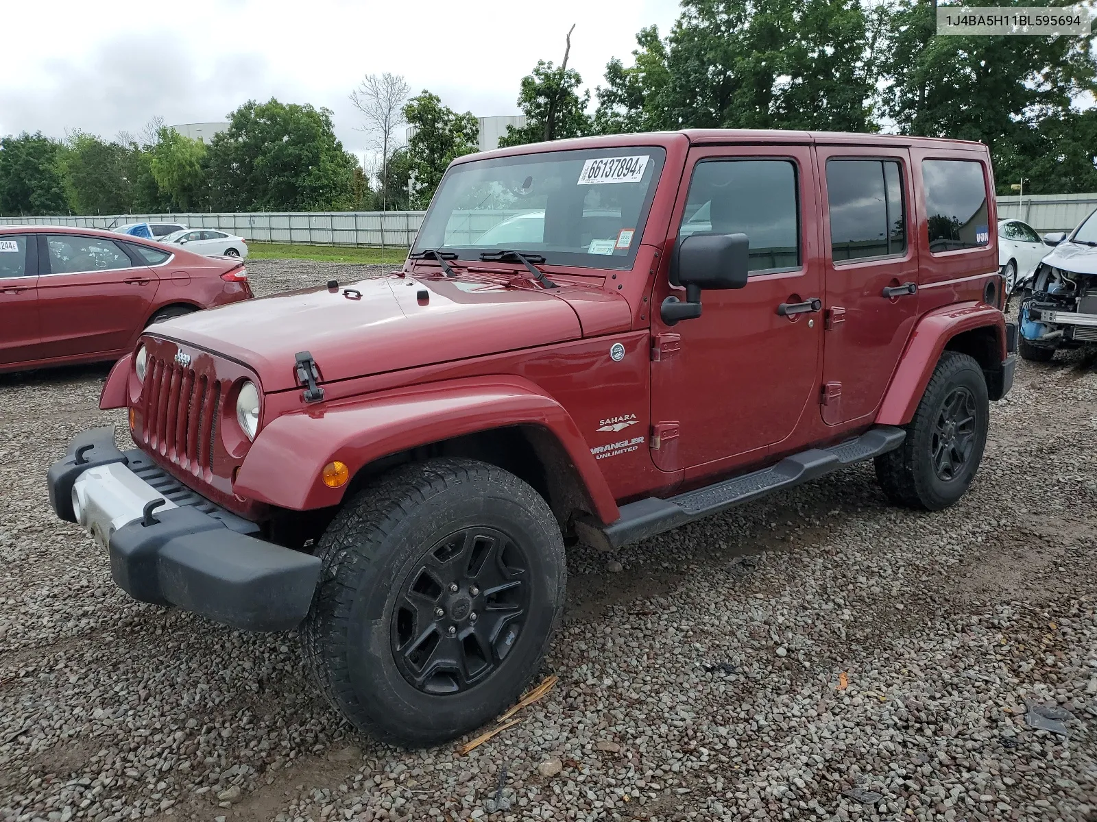 2011 Jeep Wrangler Unlimited Sahara VIN: 1J4BA5H11BL595694 Lot: 66137894