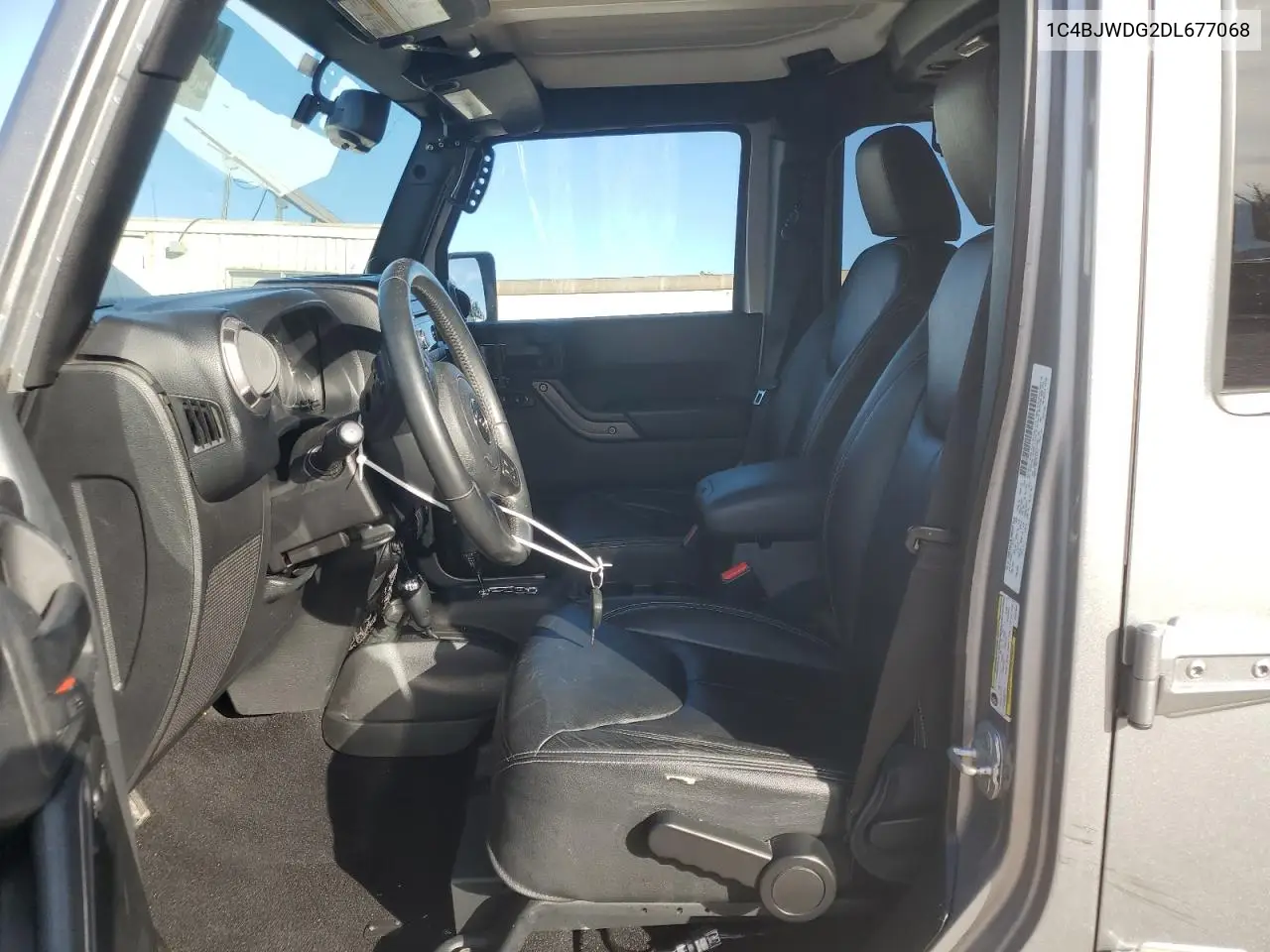 1C4BJWDG2DL677068 2013 Jeep Wrangler Unlimited Sport