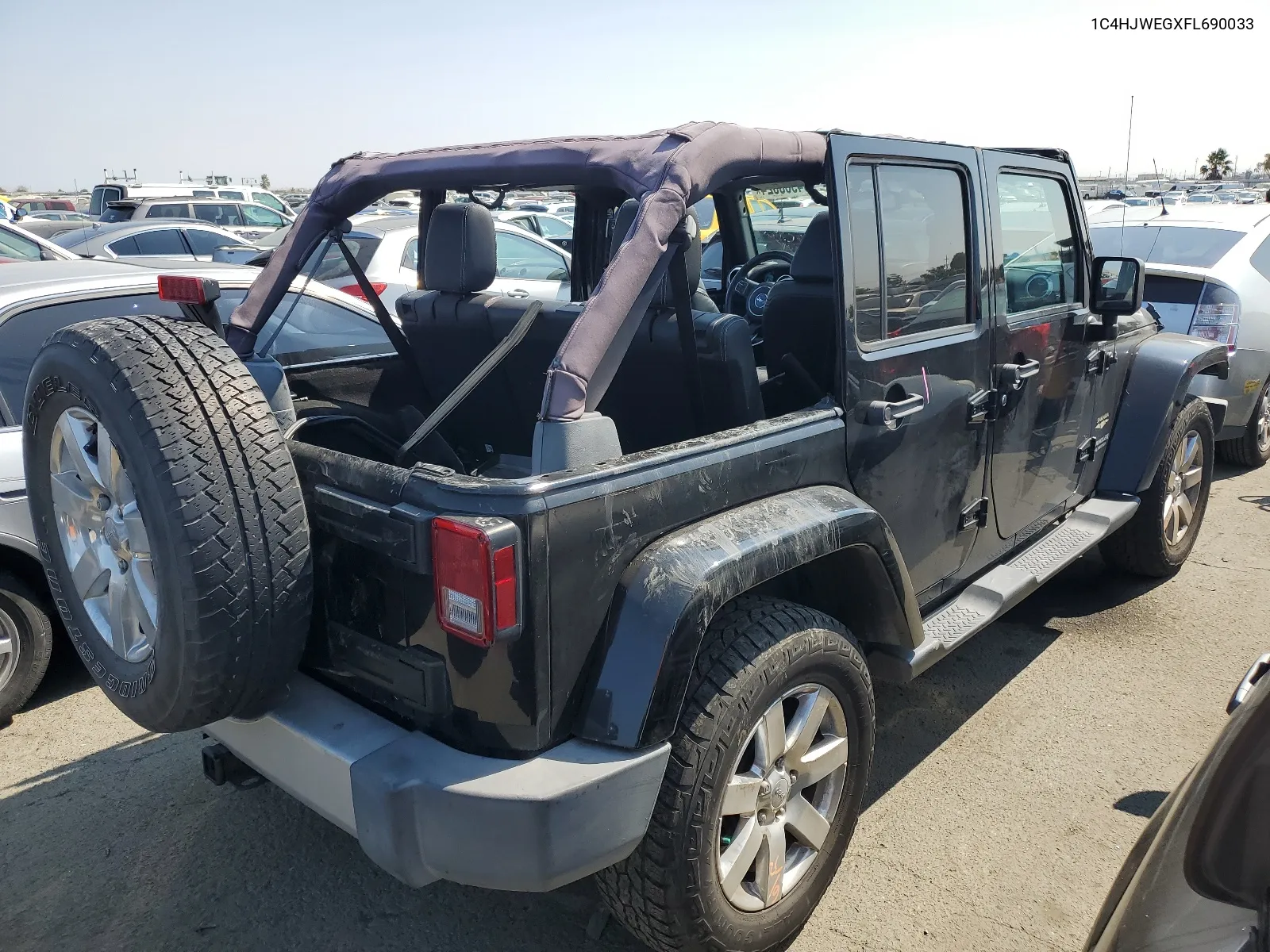 2015 Jeep Wrangler Unlimited Sahara VIN: 1C4HJWEGXFL690033 Lot: 64988024