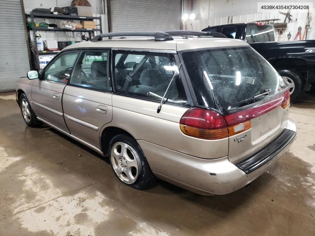 1999 Subaru Legacy L VIN: 4S3BK4354X7304208 Lot: 44354304