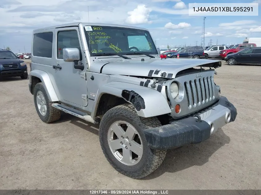 2011 Jeep Wrangler Sahara VIN: 1J4AA5D1XBL595291 Lot: 12017346