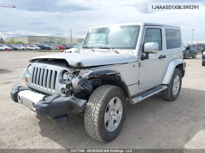 2011 Jeep Wrangler Sahara VIN: 1J4AA5D1XBL595291 Lot: 12017346