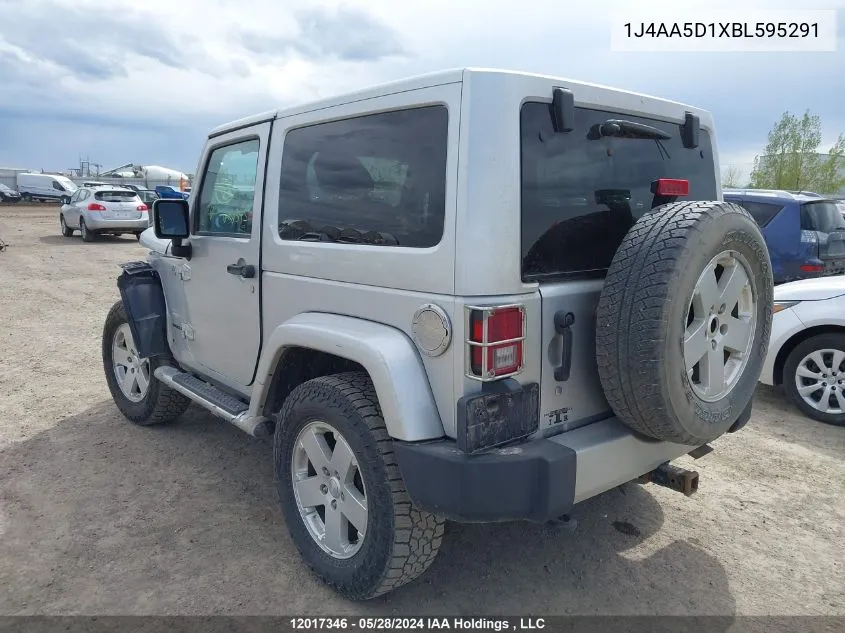 2011 Jeep Wrangler Sahara VIN: 1J4AA5D1XBL595291 Lot: 12017346