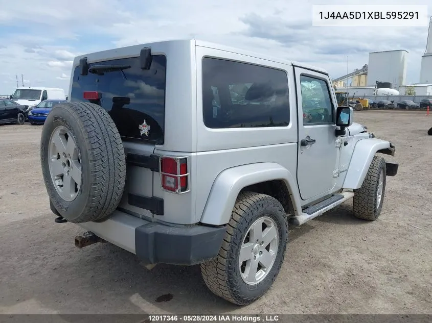 2011 Jeep Wrangler Sahara VIN: 1J4AA5D1XBL595291 Lot: 12017346